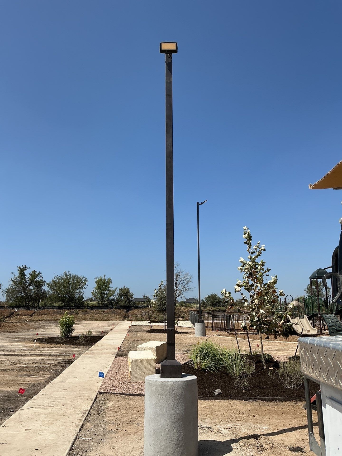 Light pole installation on concrete base — Tristar Services LLC